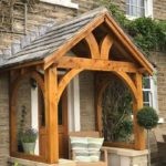 Green oak porch Arched gallows