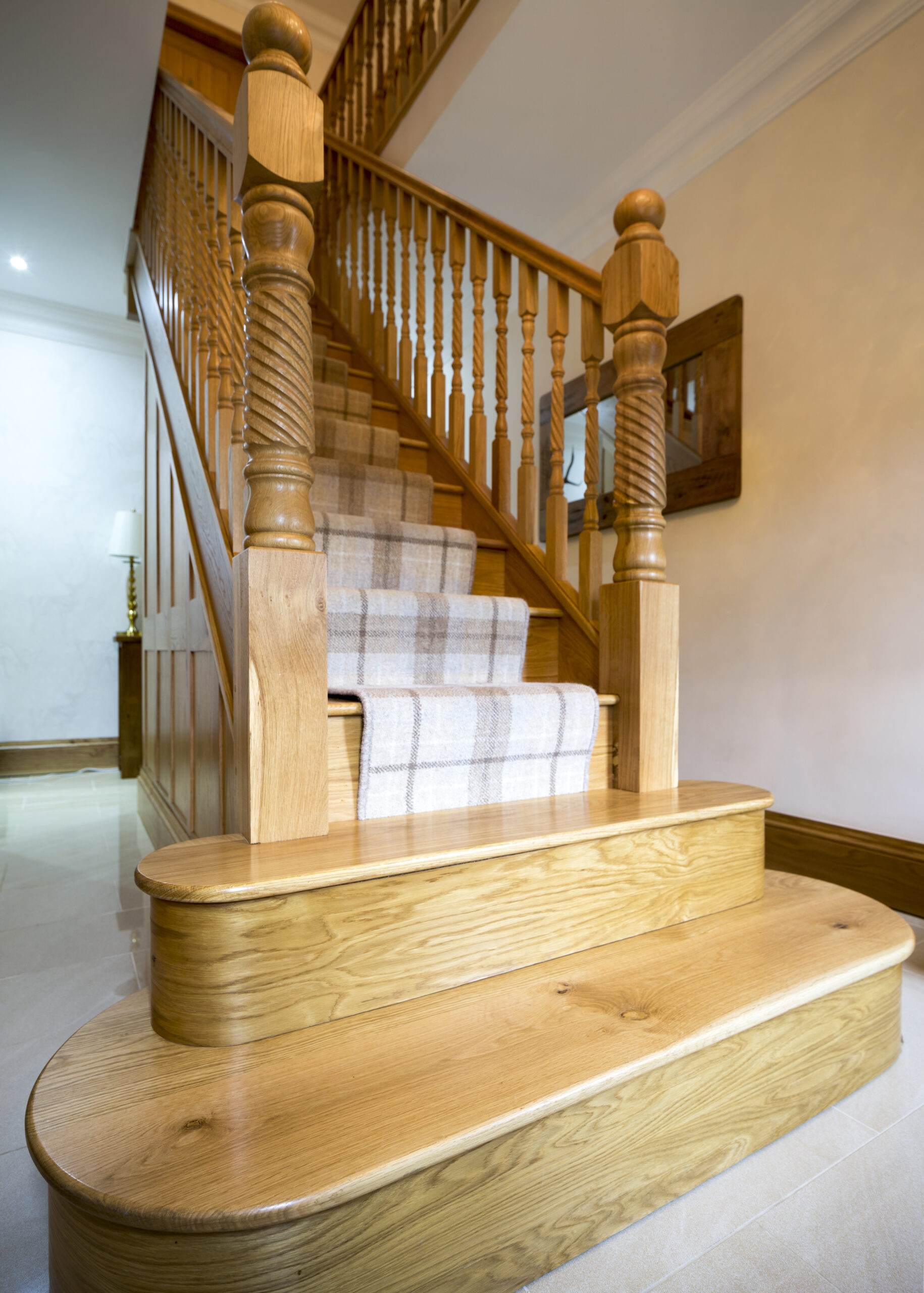 Bespoke oak and hardwood staircase with turned spindles by The Oak Workshop